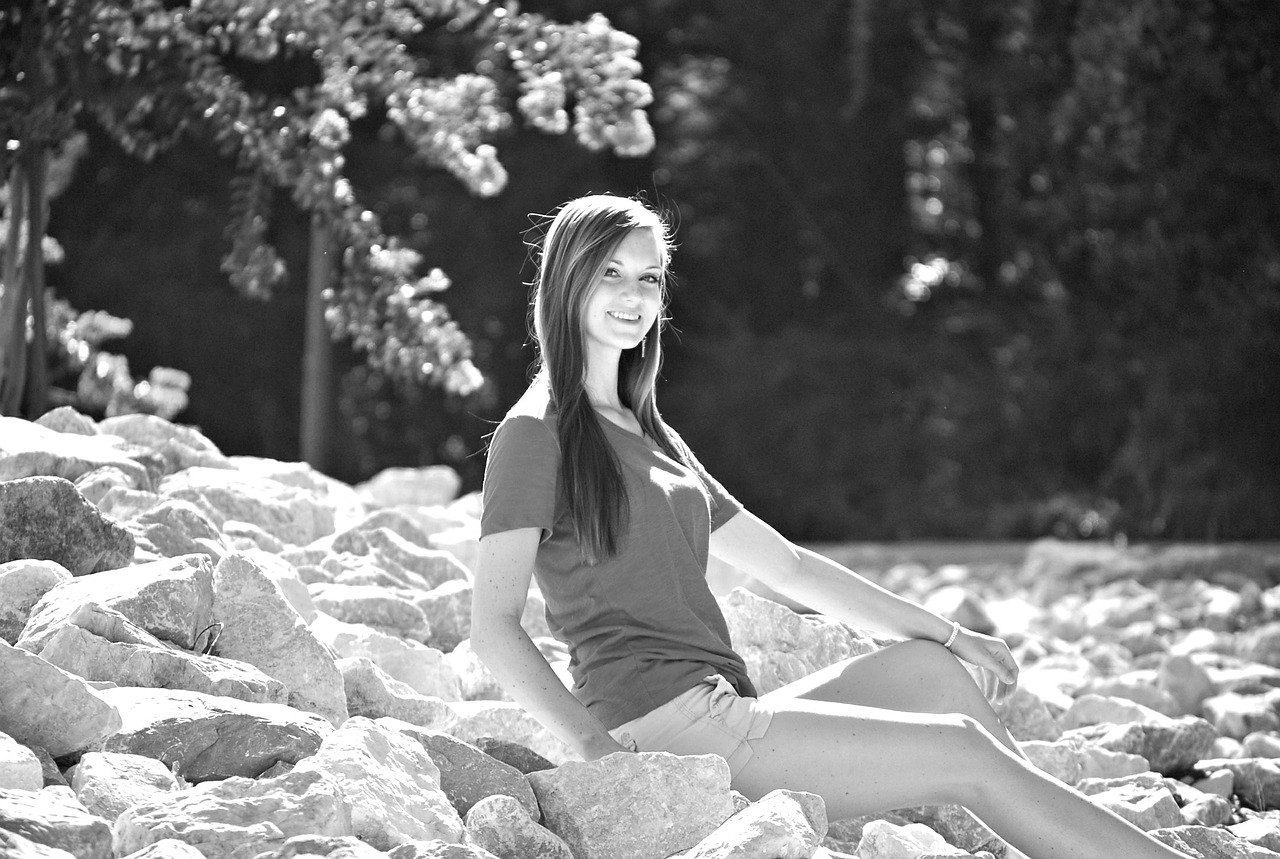 girl sitting rocks free photo