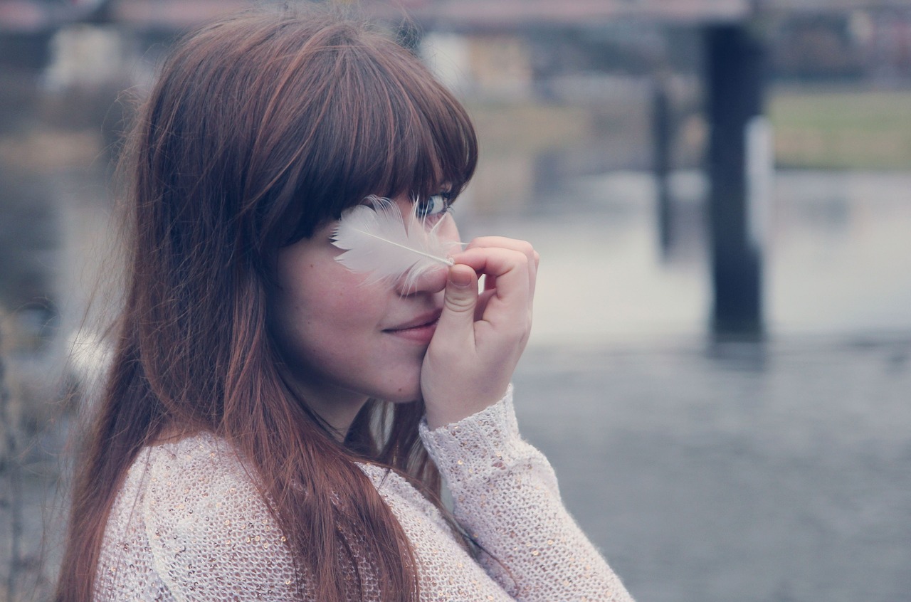 girl portrait feather free photo