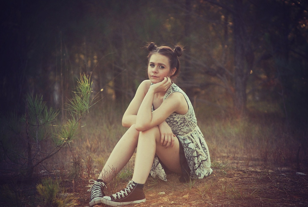 girl sitting outside free photo