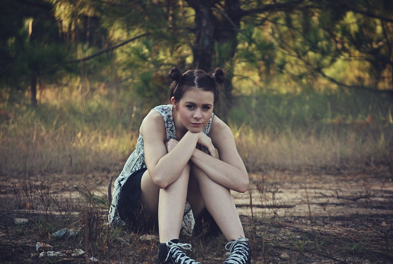 girl sitting grass free photo