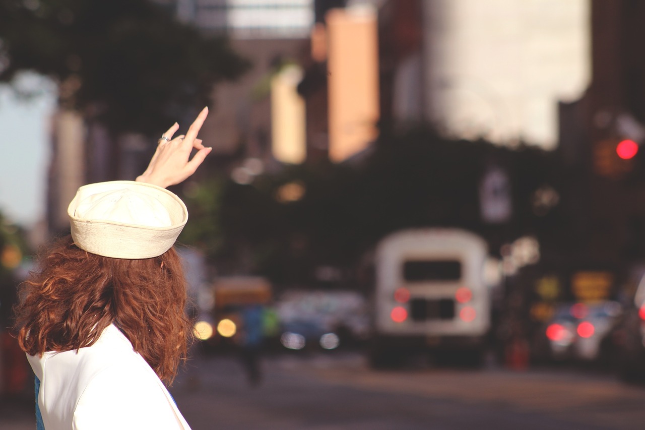 girl waiving bus free photo