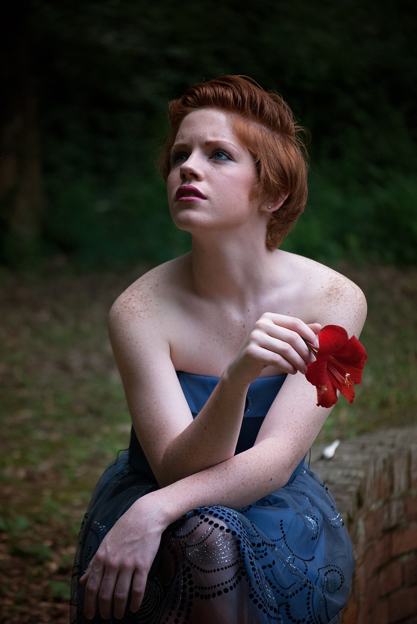 girl sitting outdoors free photo