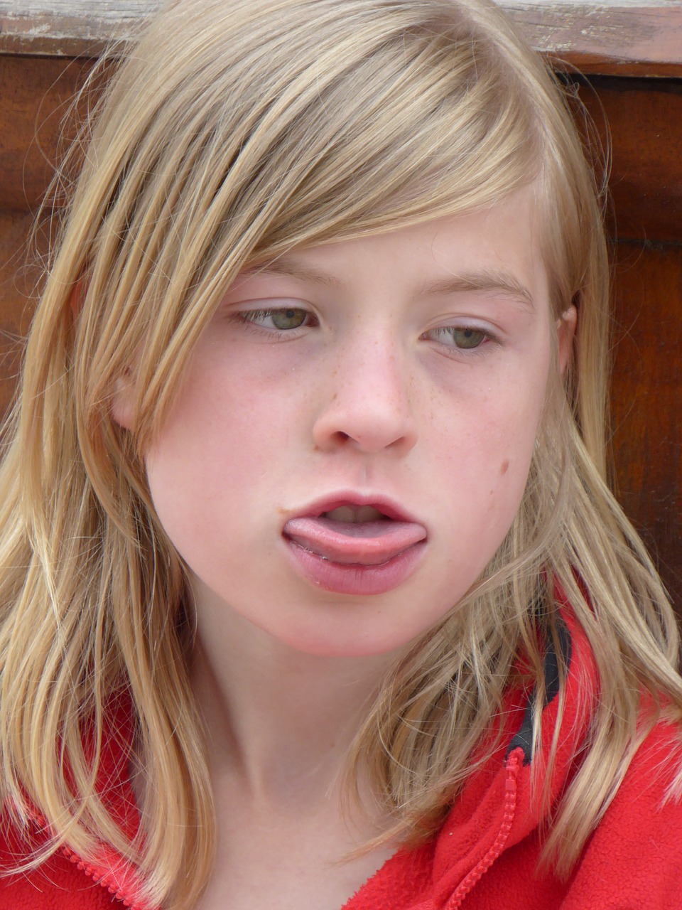 girl tongue consider free photo