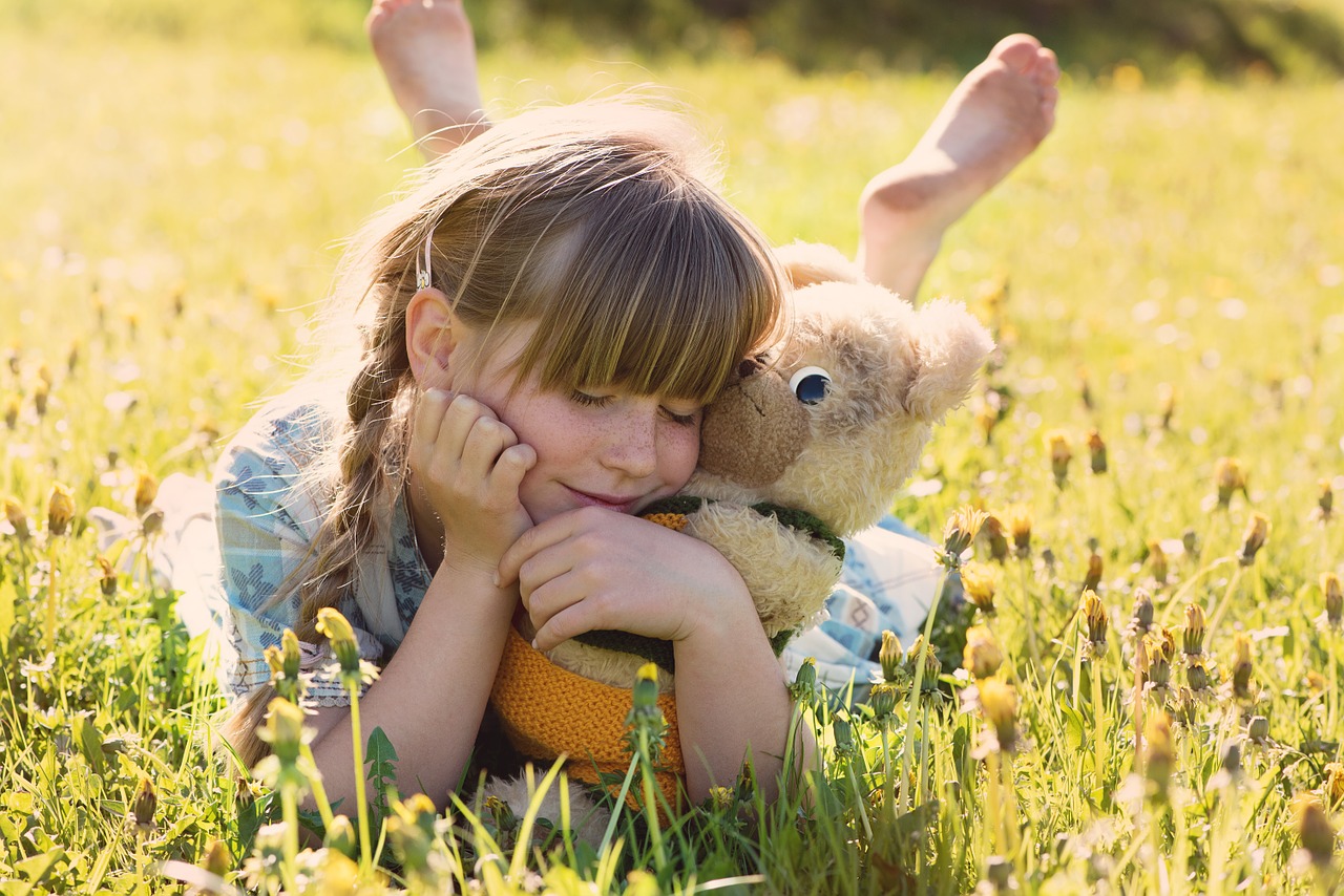 girl teddy bear snuggle free photo