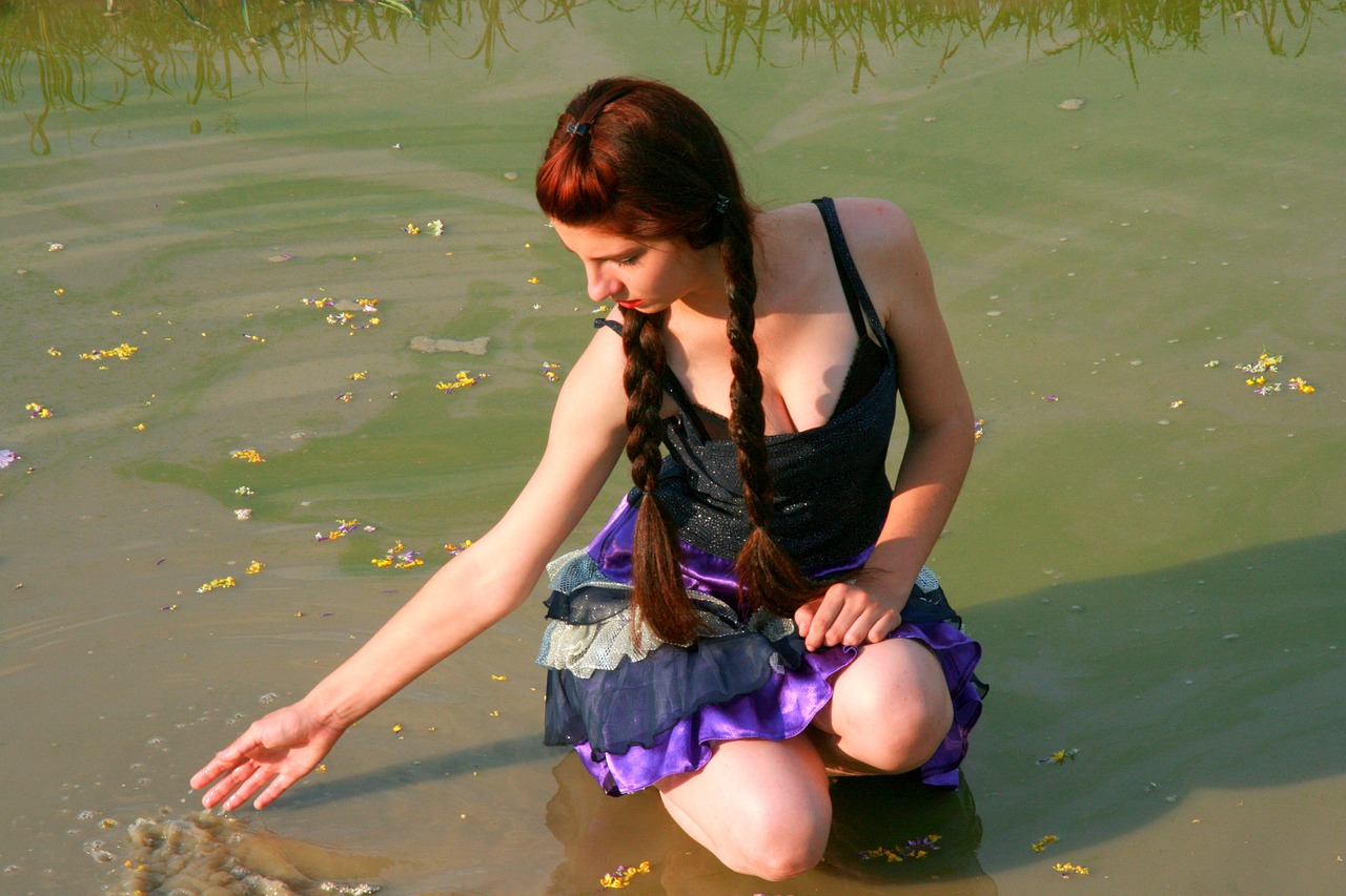 girl lake flowers free photo