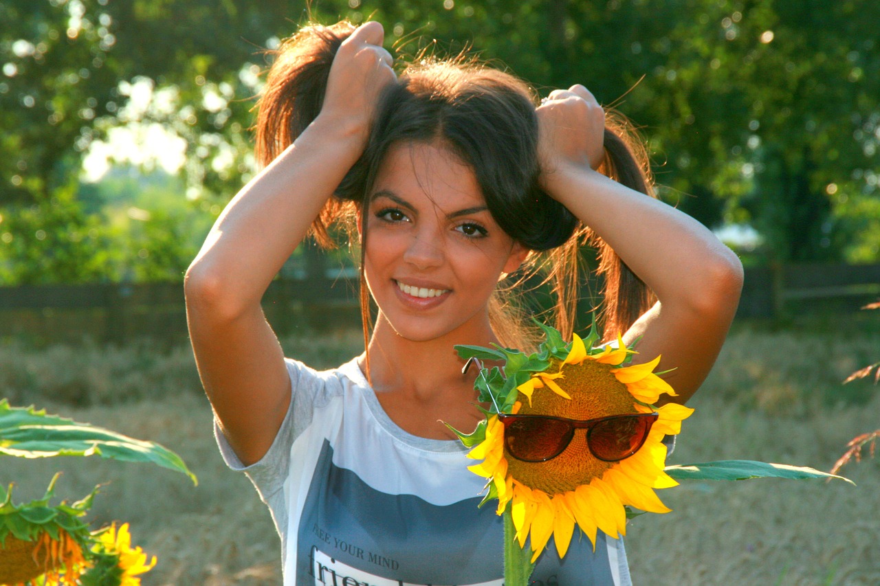 girl sunflower smile free photo