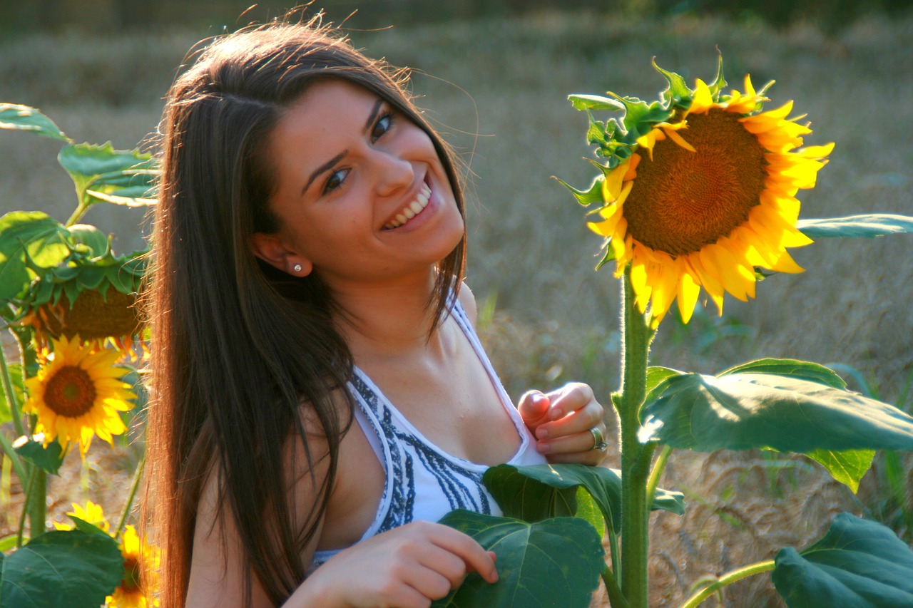 girl sunflower smile free photo