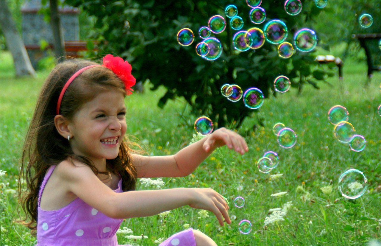 girl soap bubbles smile free photo