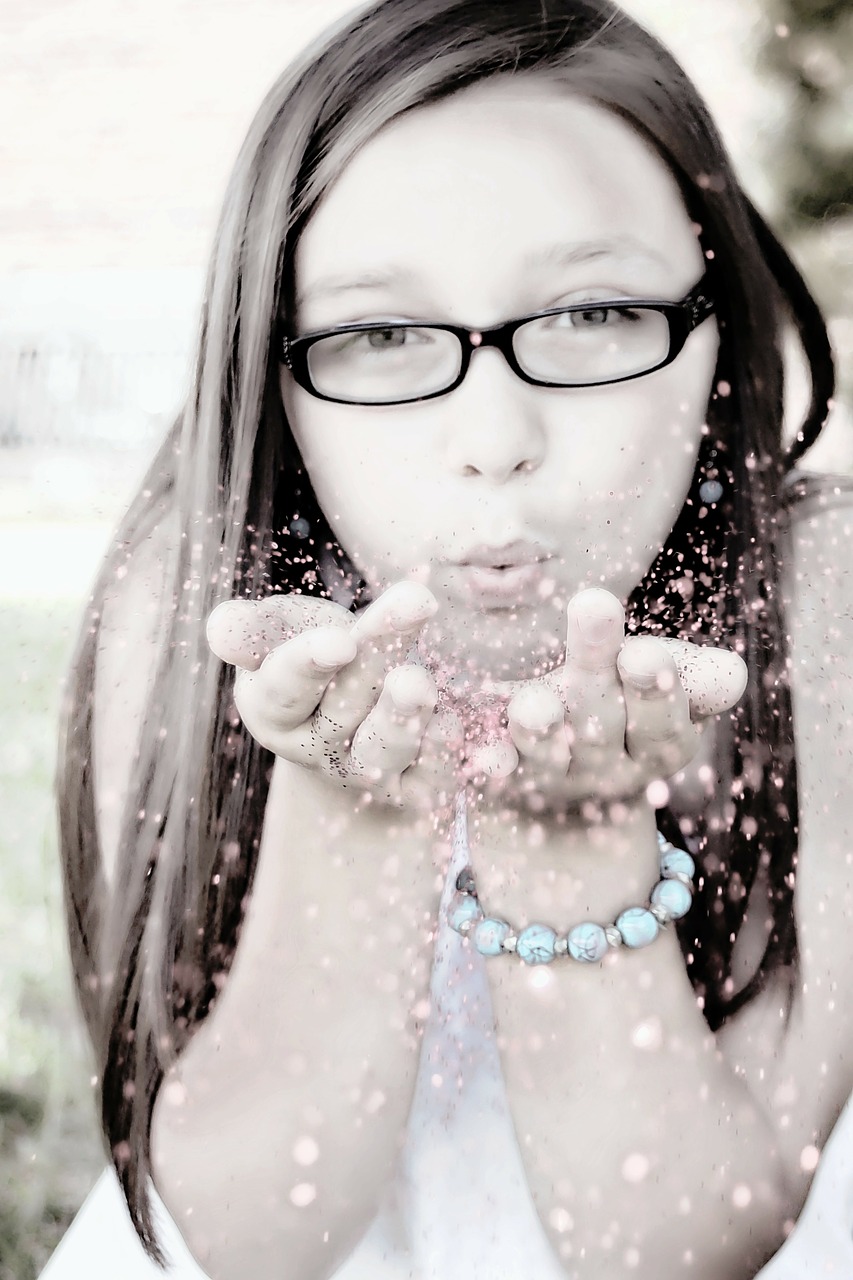 girl blowing glitter face portrait free photo