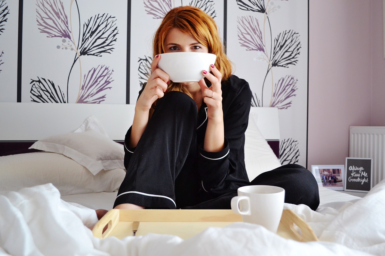 girl in bed breakfast in bed girl with cereal bowl free photo
