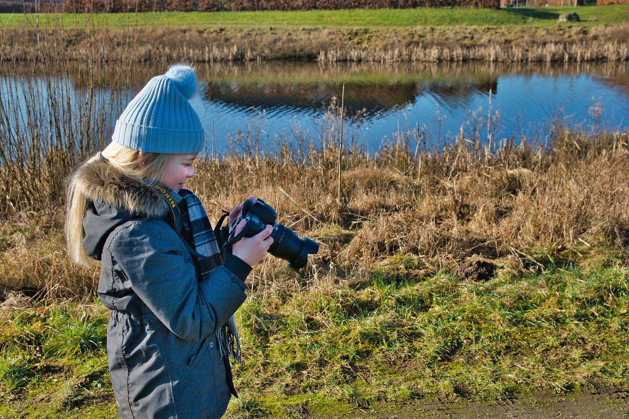 girl photographing  child  camera free photo