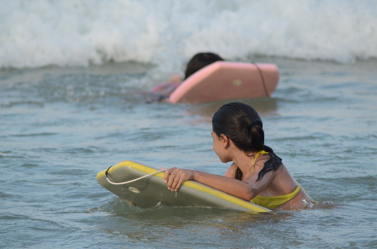 girl playing in the water water mar free photo