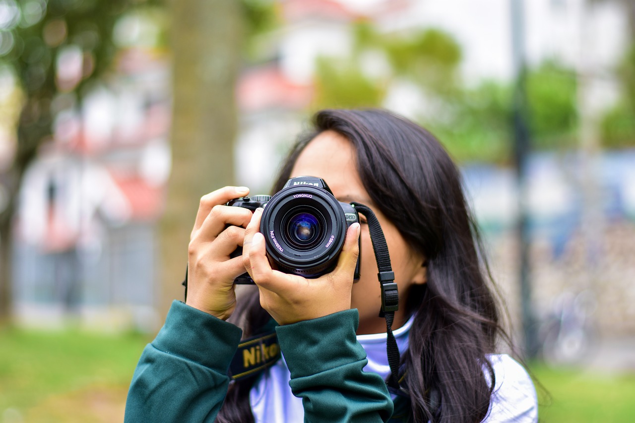 girl taking photo  camera  photographer free photo