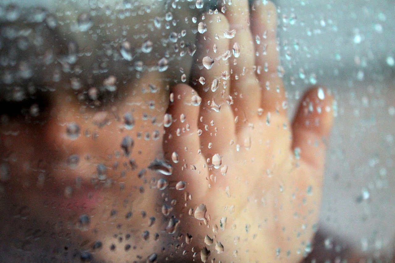 glass rainy window hand free photo