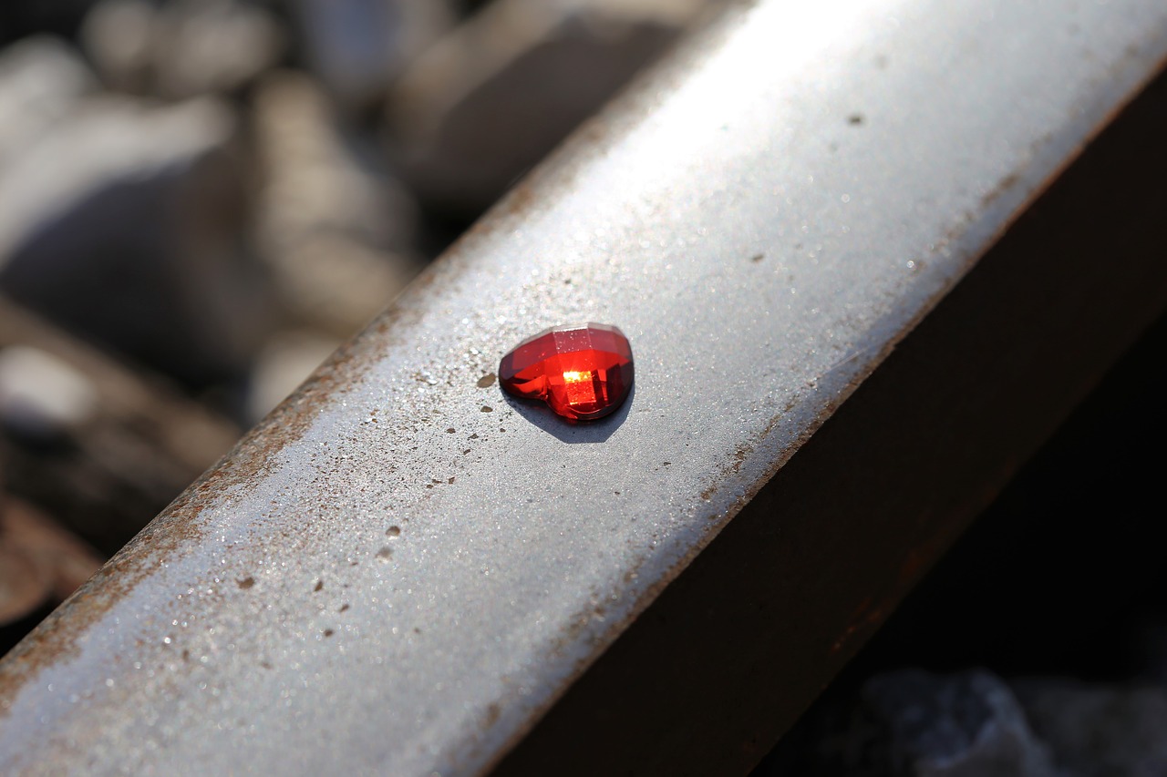 glowing red heart on railway stop children suicide stop teenager suicide free photo