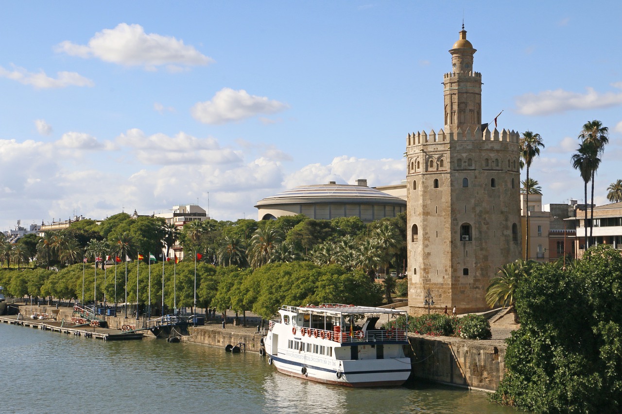 gold tower seville river free photo