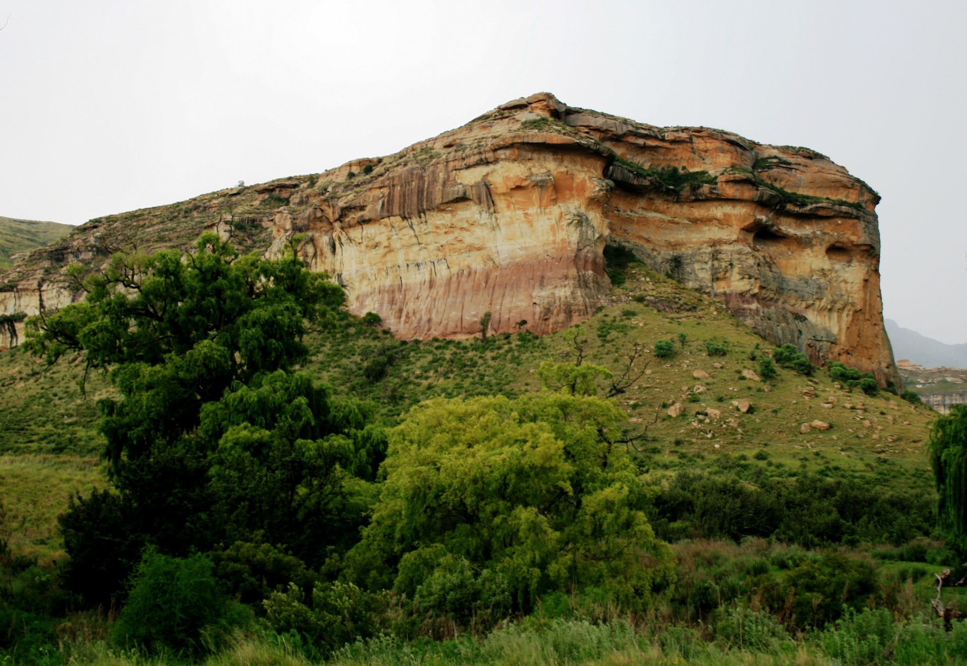 sandstone cliff face triple protrusion free photo