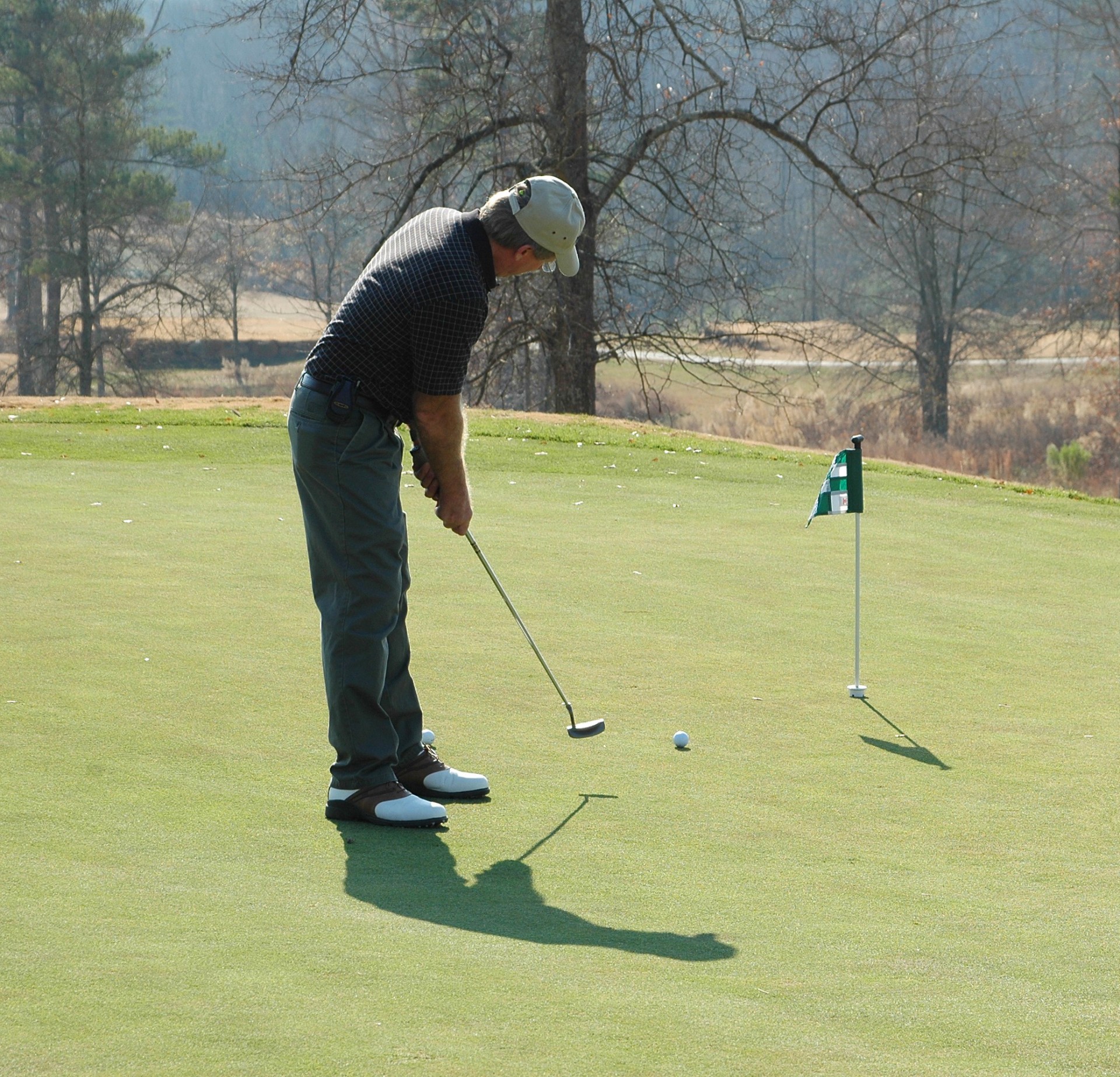 person putting green golf free photo