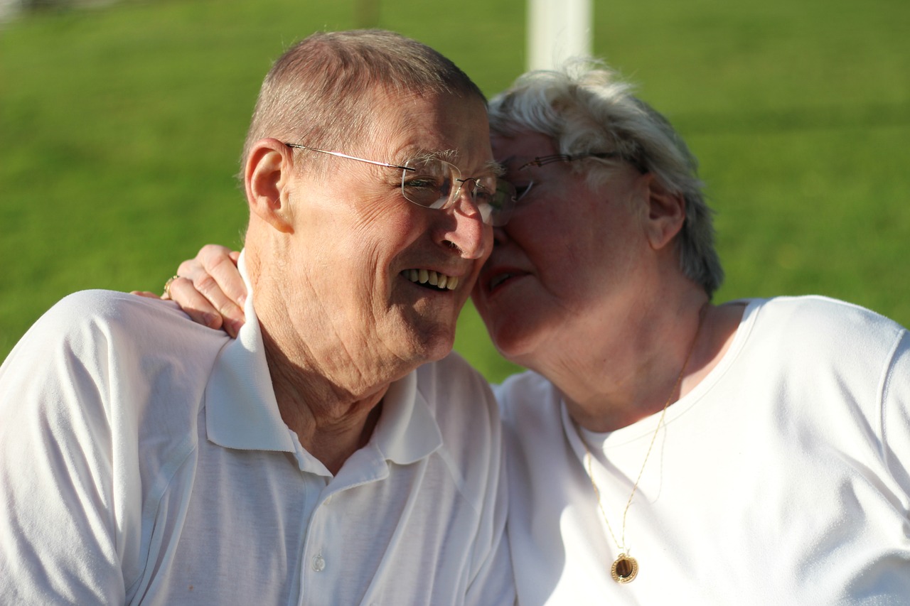 grandparents  outdoors  snuggling free photo