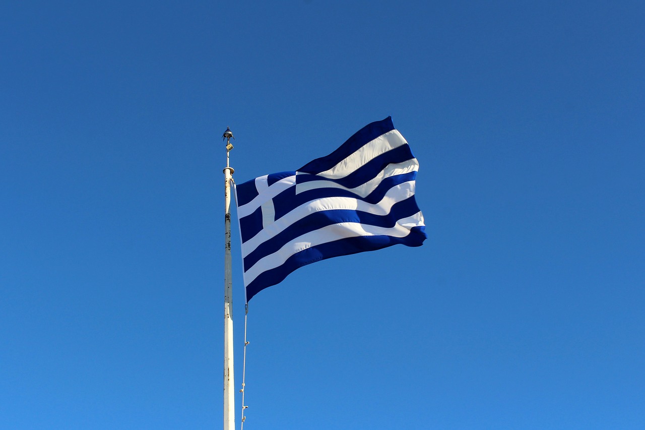 greece the flag of greece the flag on the acropolis free photo