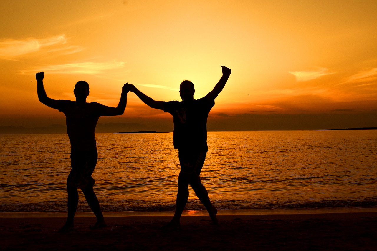 greek dancing at sunset seascape sunset free photo