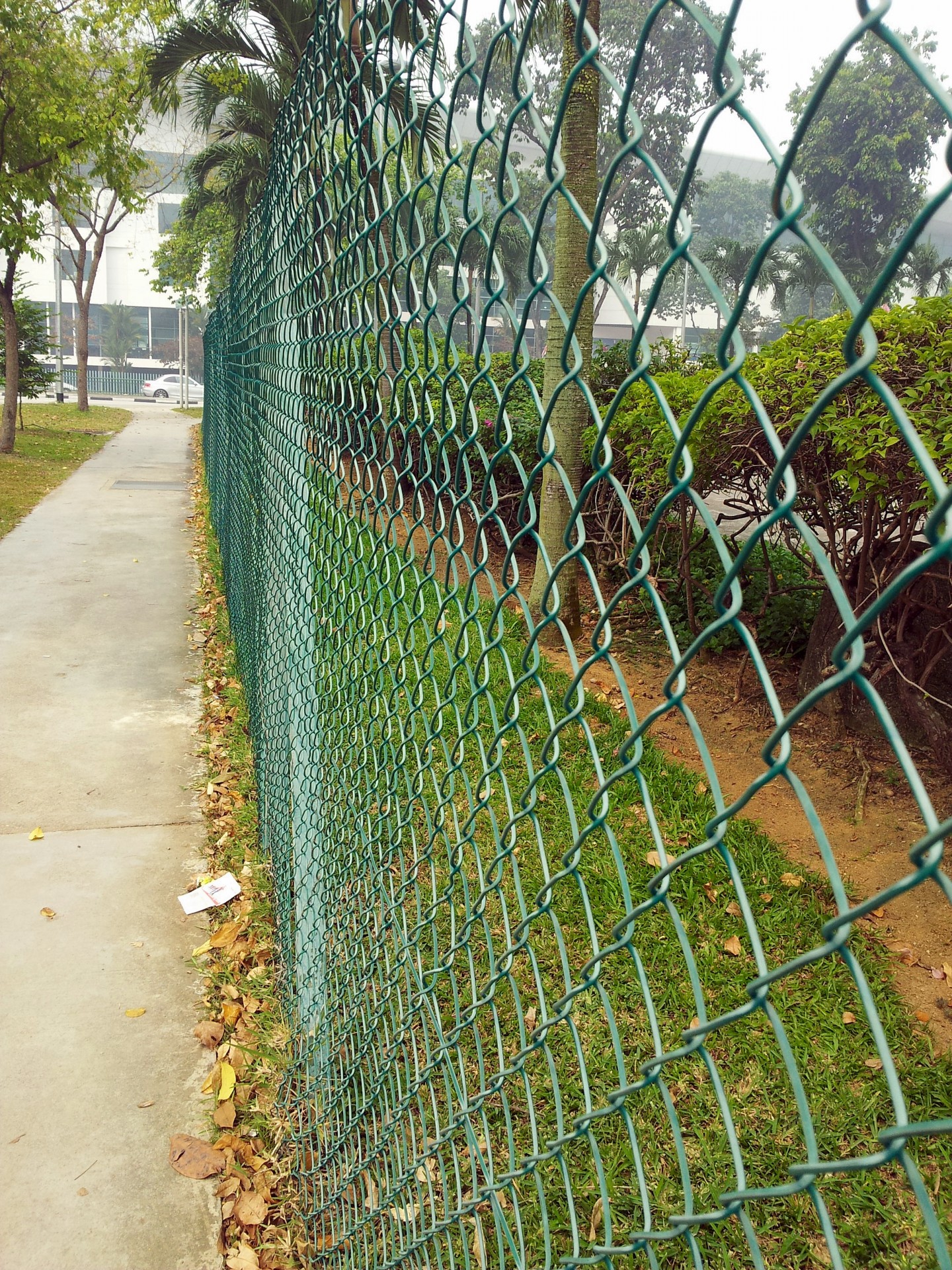 green fence pavement gravel free photo