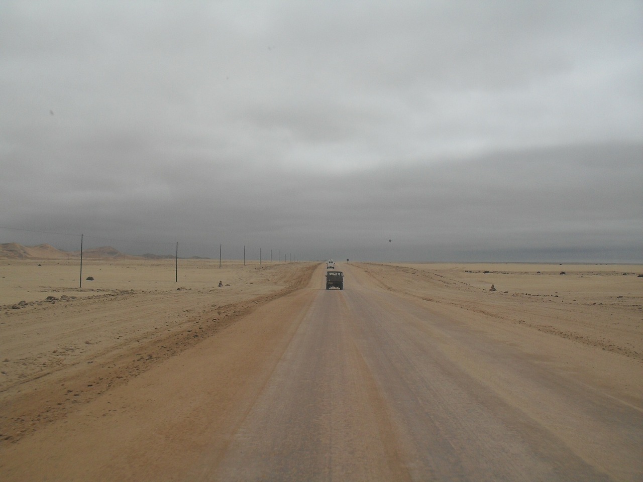 grey sky salt road lone vehicle free photo