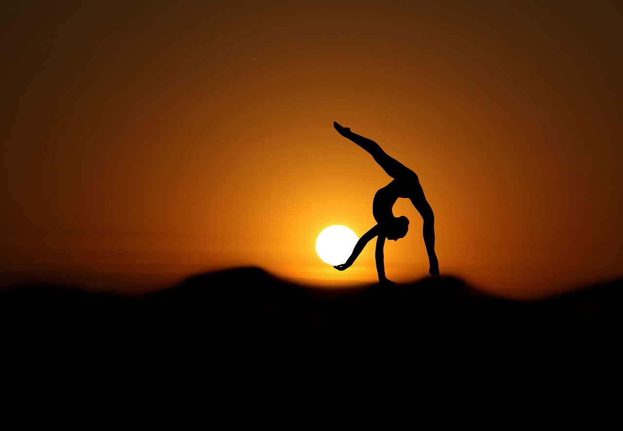 gymnast  sunset  silhouette free photo