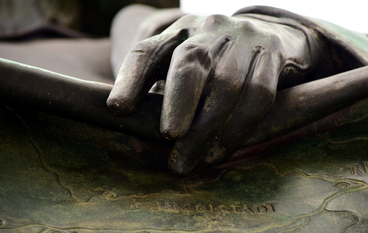 hand bronze art free photo