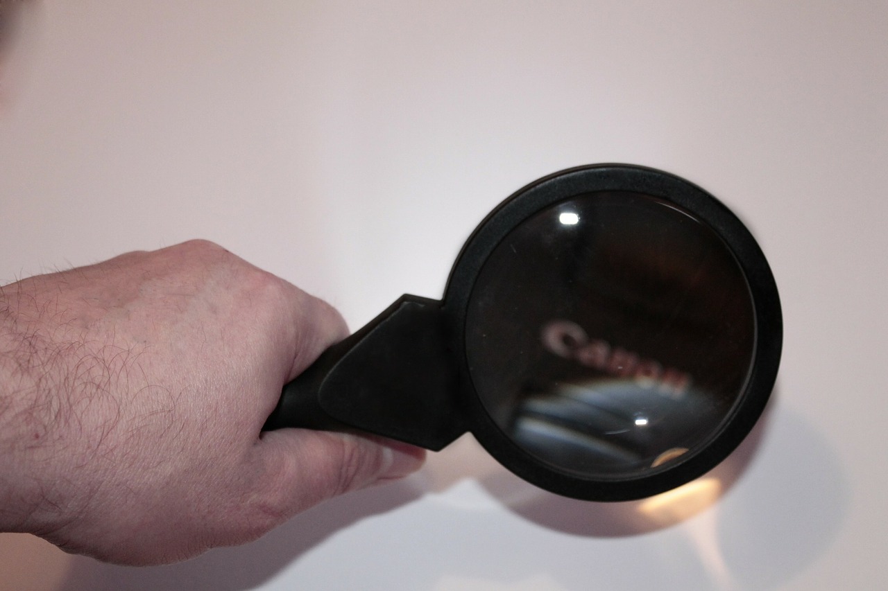 hand magnifying glass increase free photo