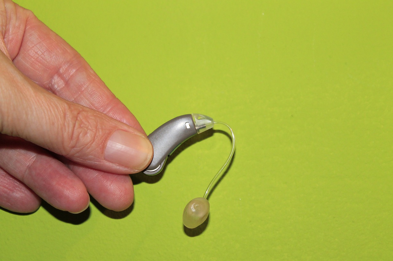 hand hearing aid deafness free photo