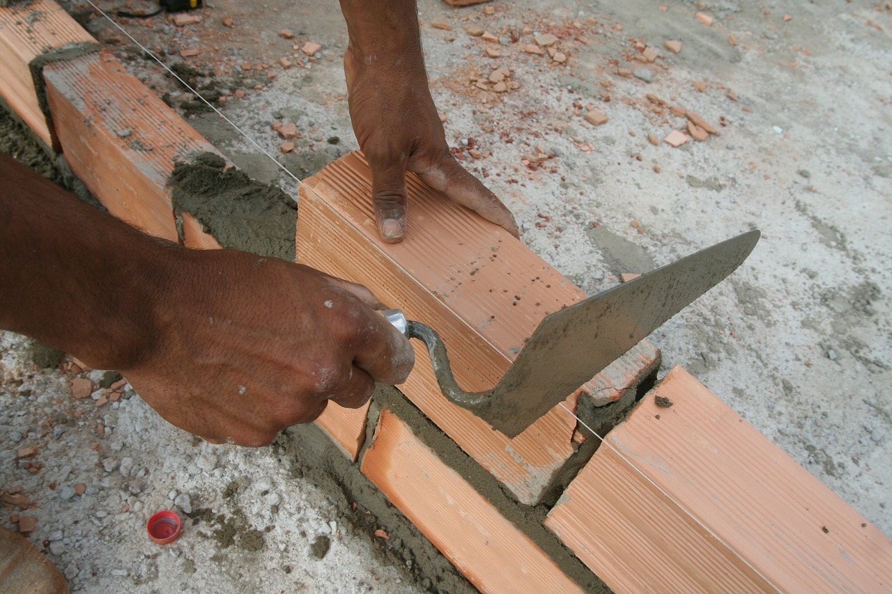 hand brick construction free photo