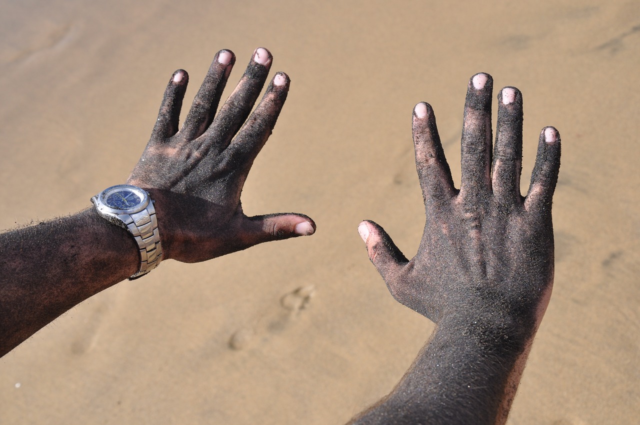 hands sand beach free photo