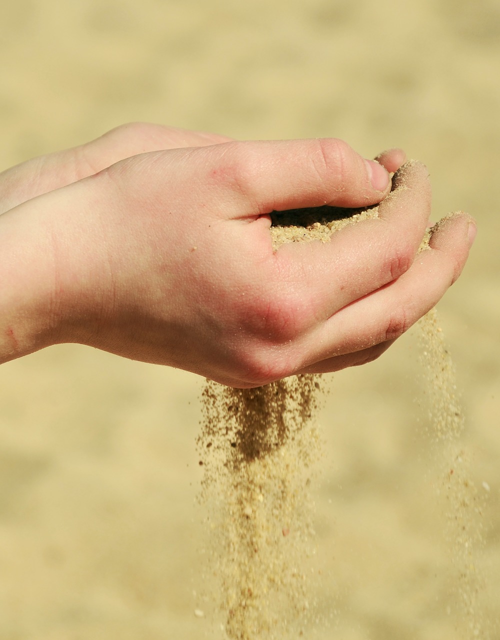 hands sand melt away free photo