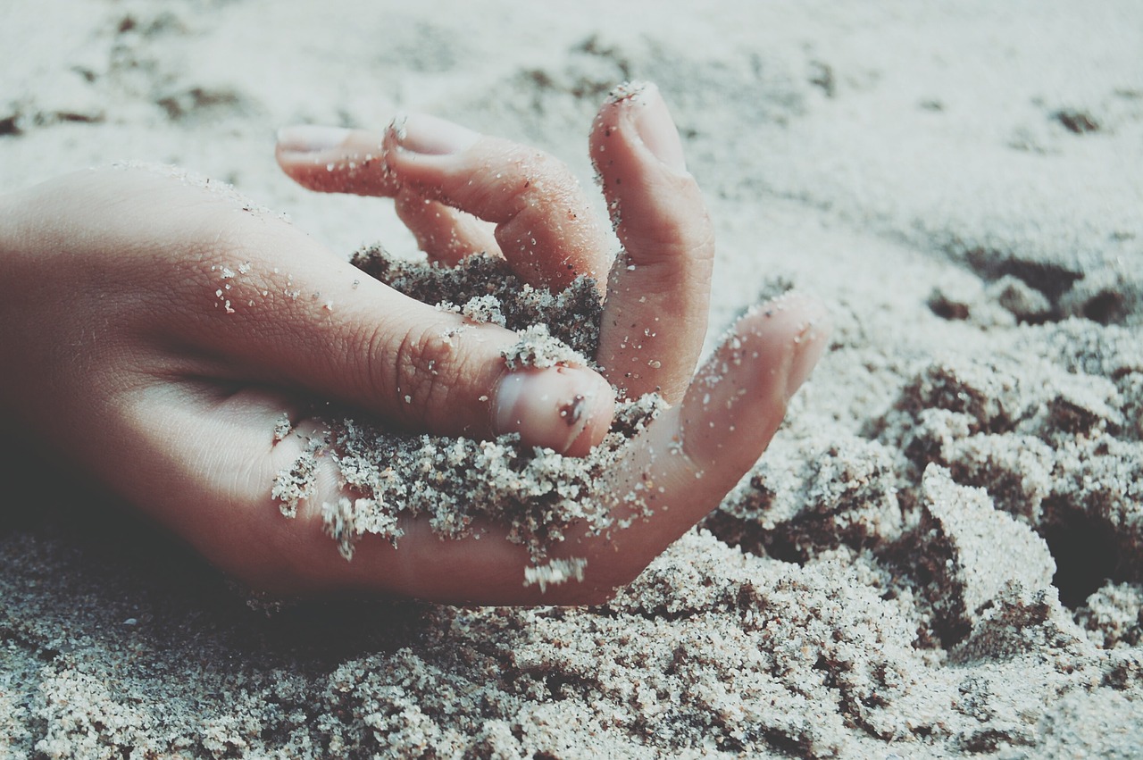 hands sand beach free photo