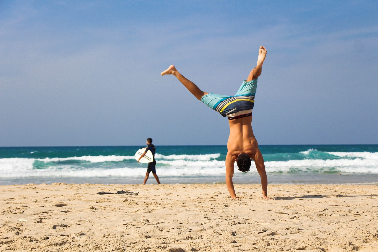 handstand beach sea free photo