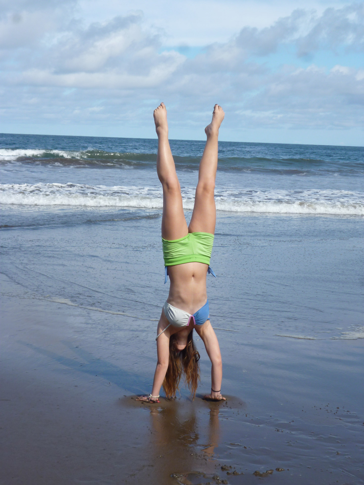 girl handstand beach free photo