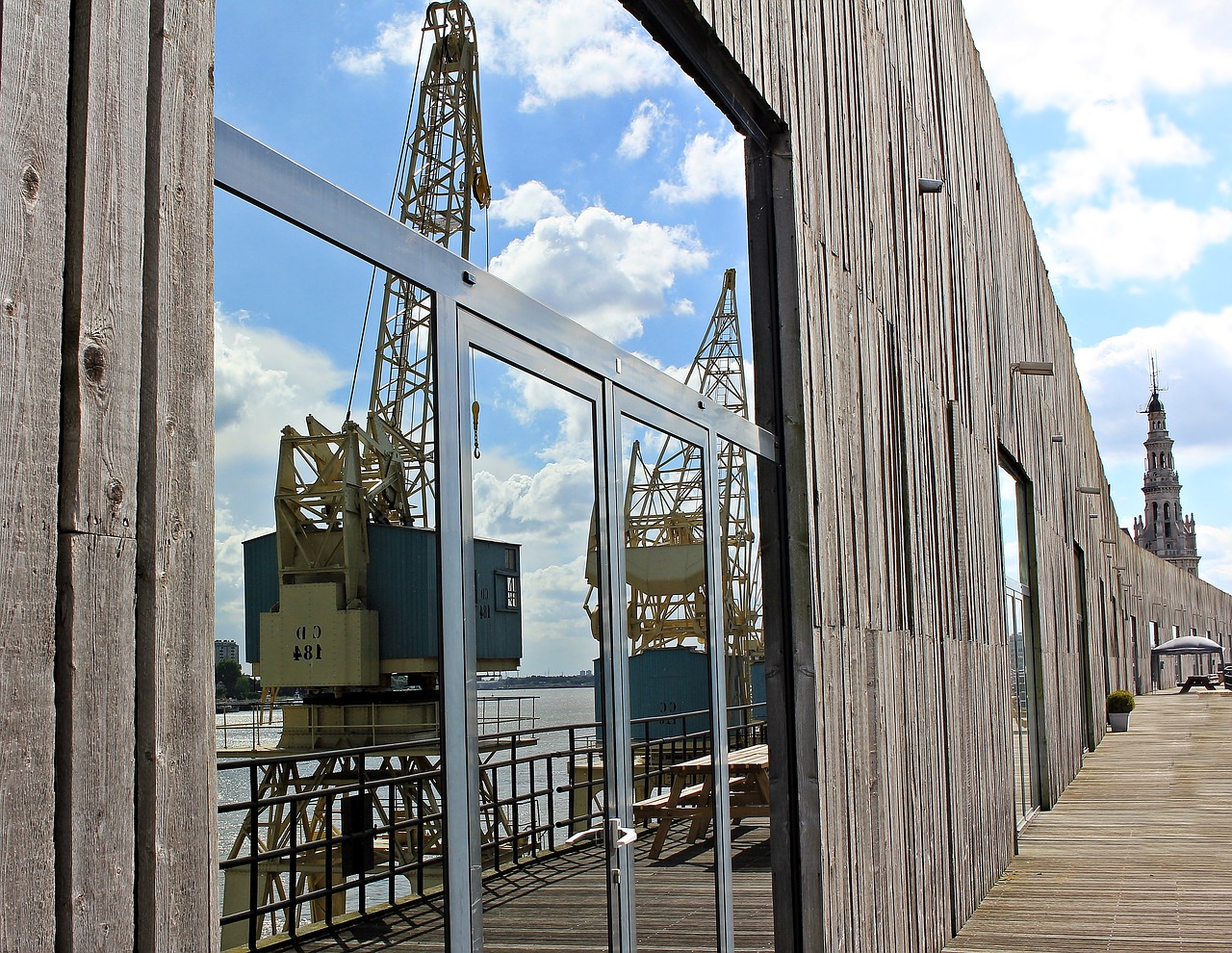 harbour cranes mirroring hanger free photo