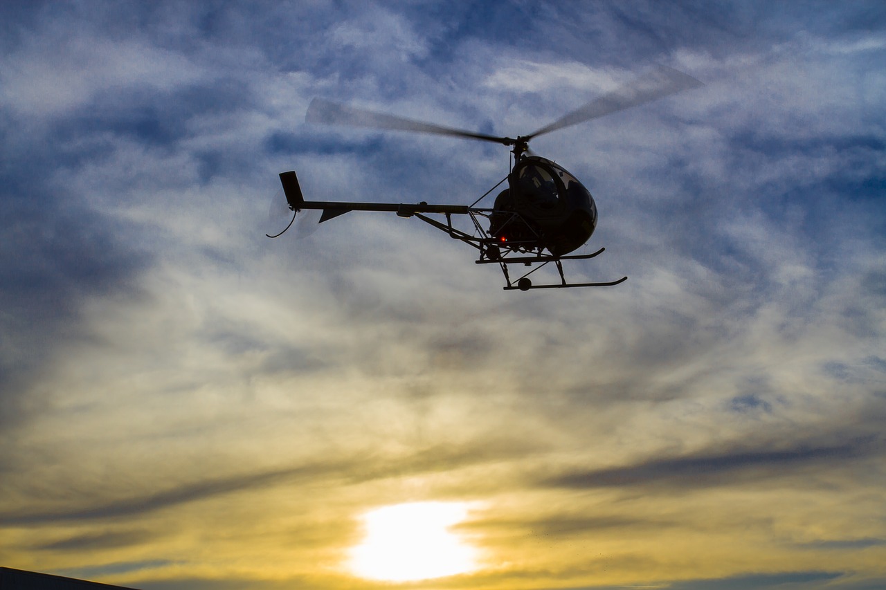 helicopter against light sky free photo