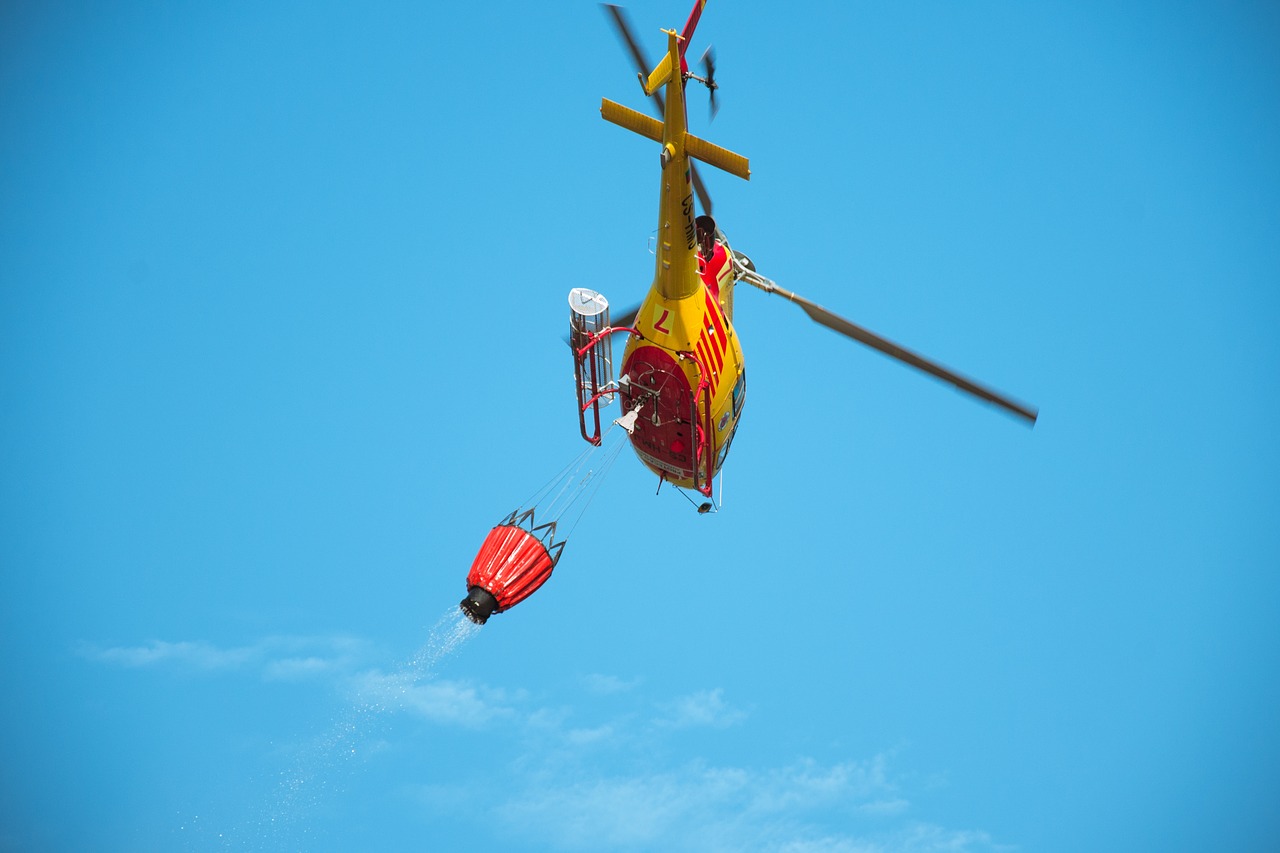 helicopter  extinguish  forest fire free photo