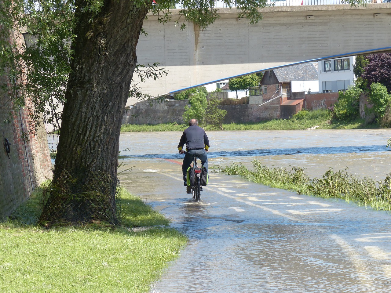 high water cyclists wet free photo