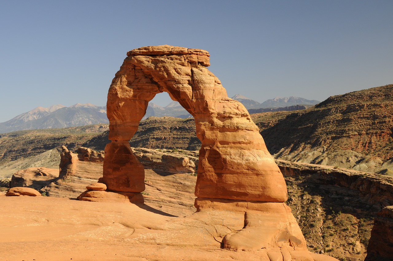 hike  stone arch  sand stone free photo