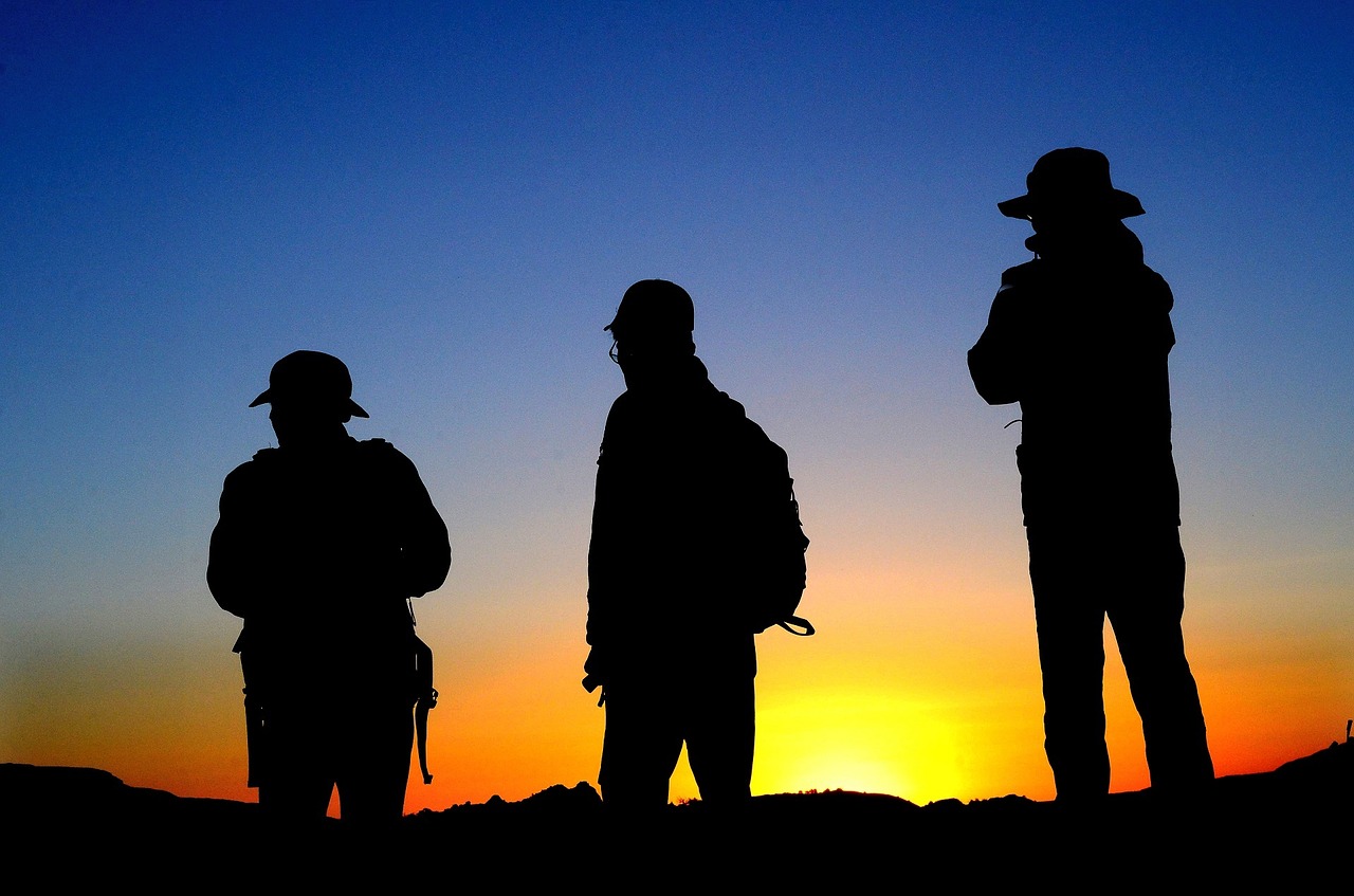 hikers silhouettes sunset free photo