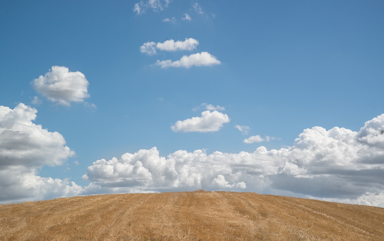 hill blue sky clouds free photo