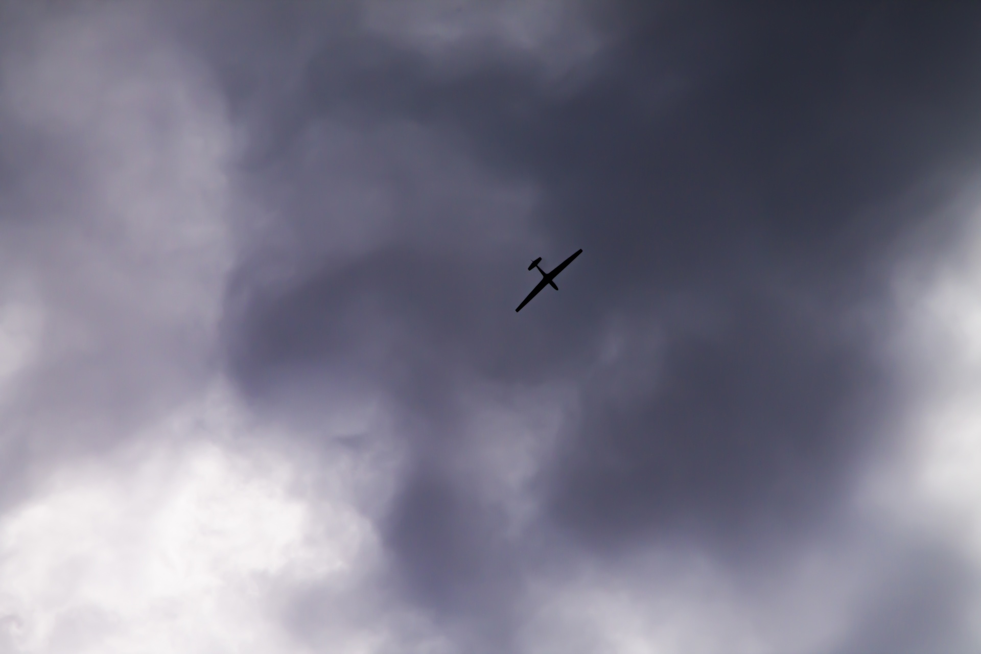 glider flying clouds free photo