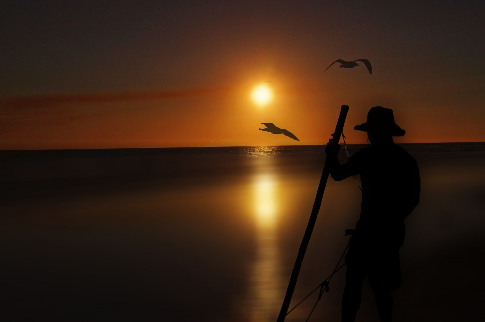 sunset fisherman sea free photo