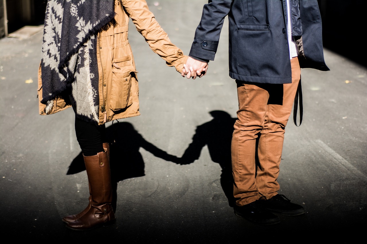 holding hands couple man free photo