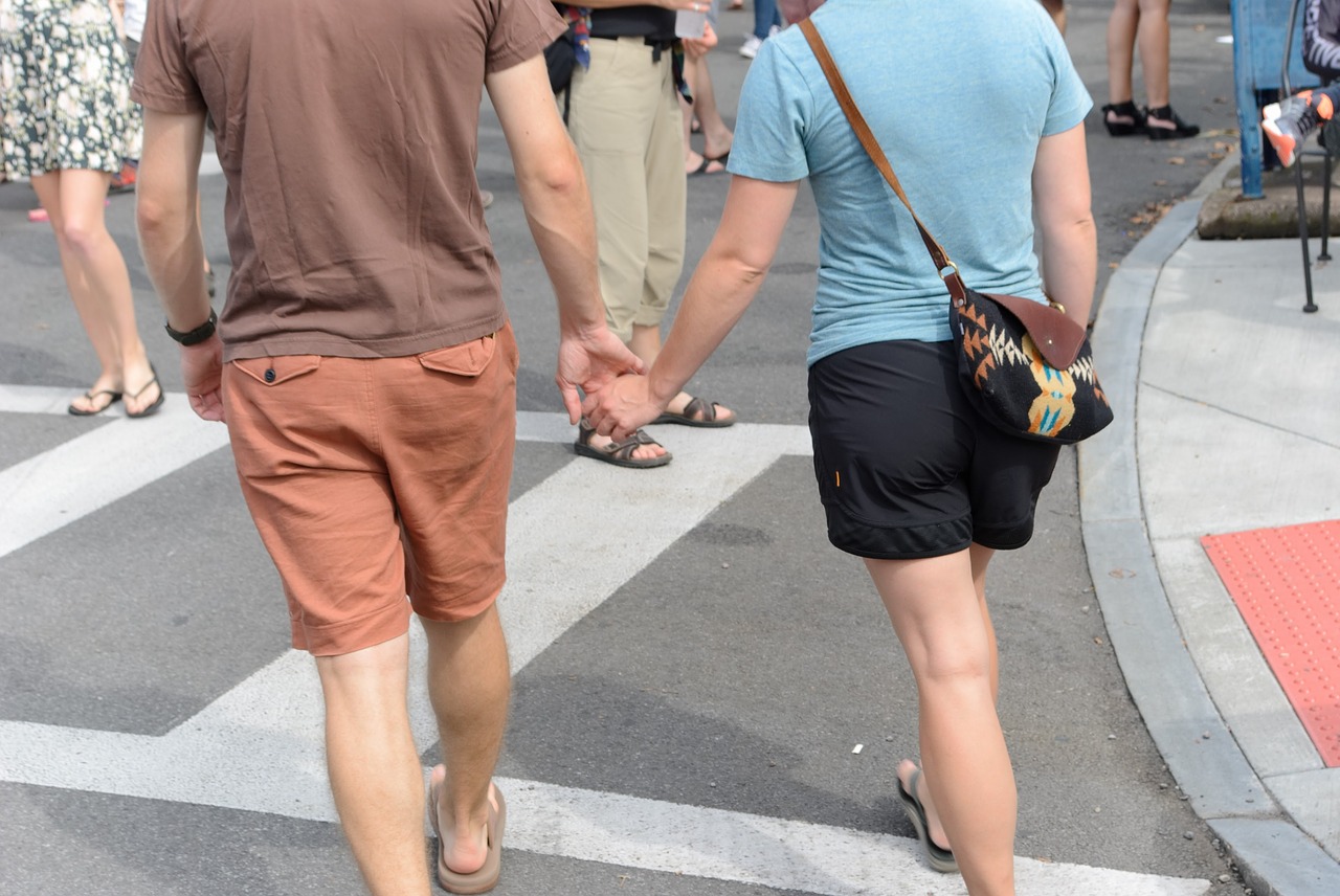 holding hands couple walking free photo