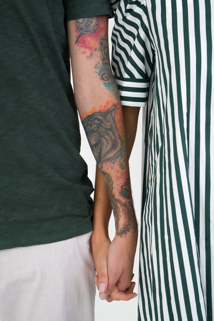 holding hands  tattoos  couple free photo