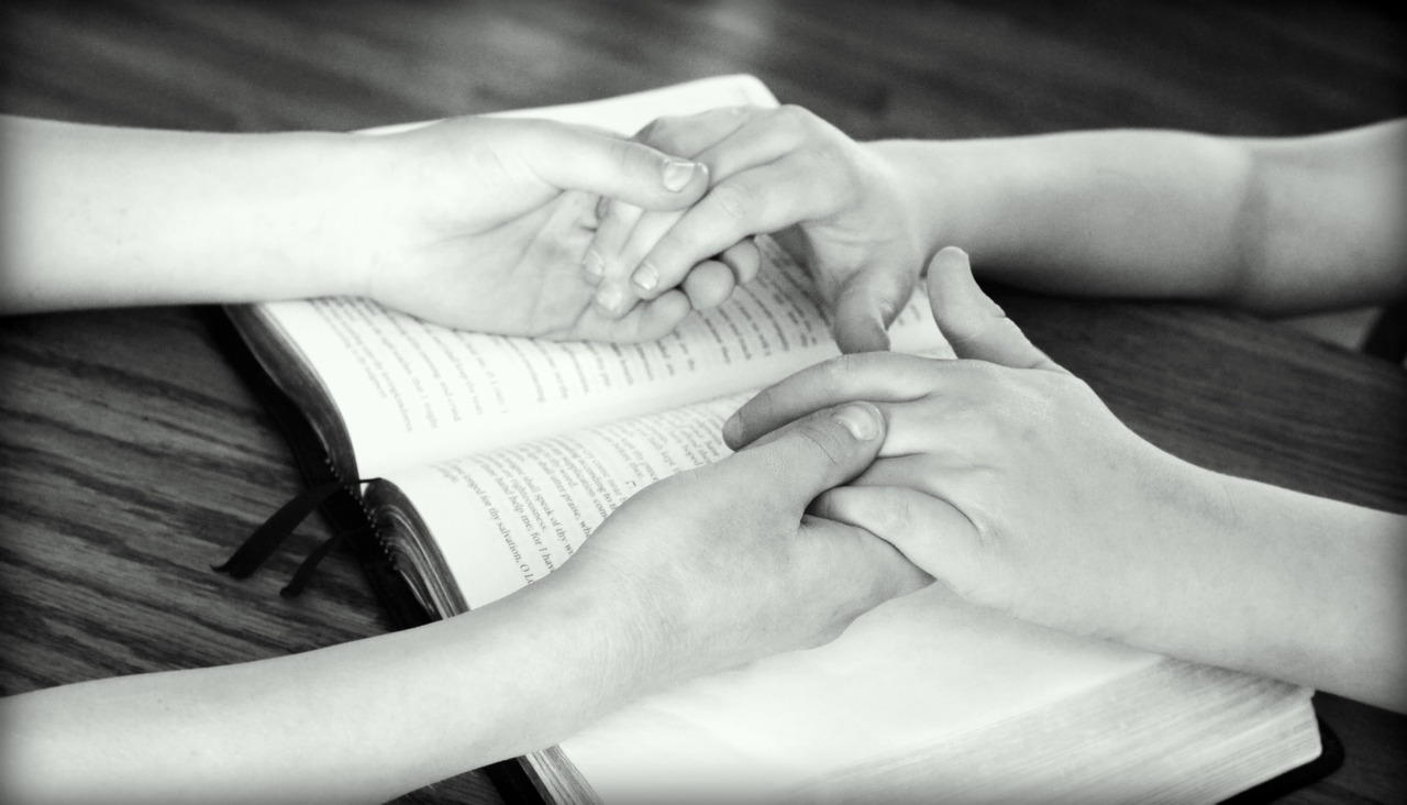 holding hands bible praying free photo